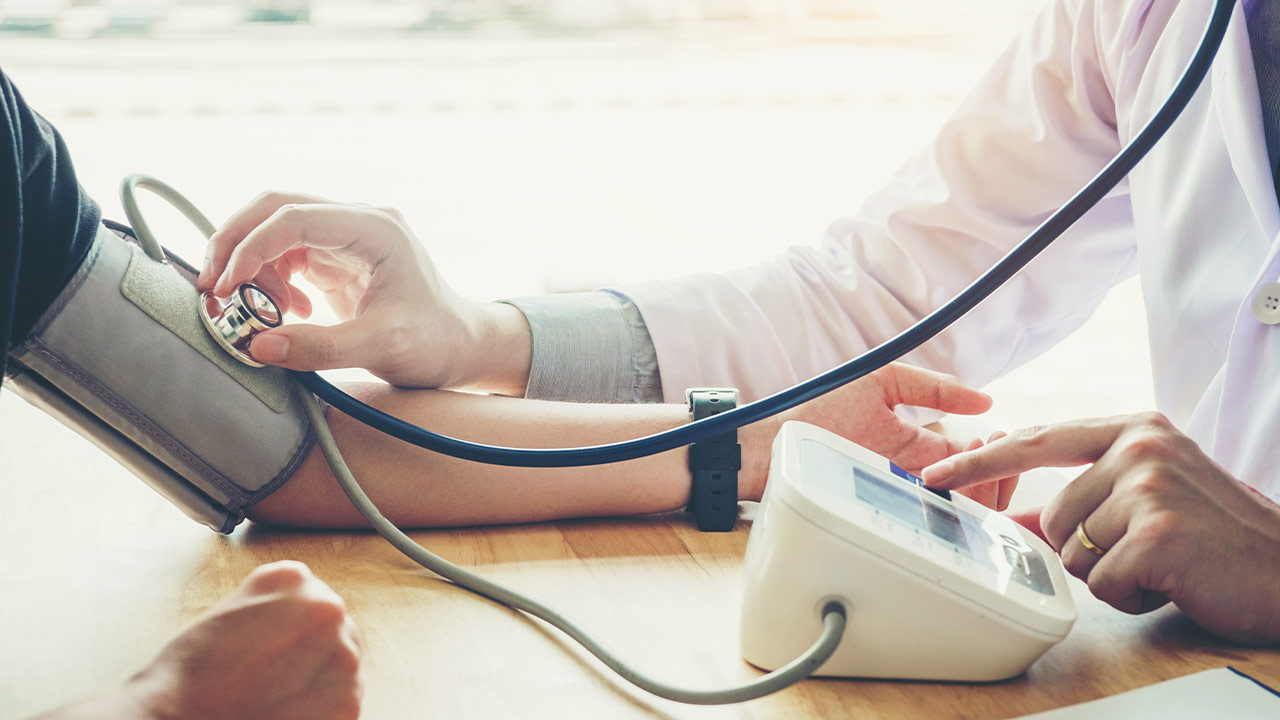 Person getting their blood pressure monitored