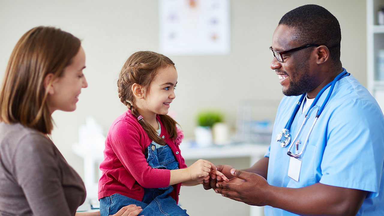 Doctor with kid and mother