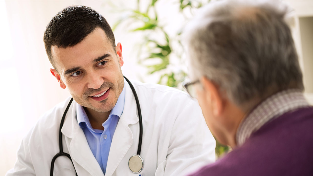 Doctor and patient speaking with each other