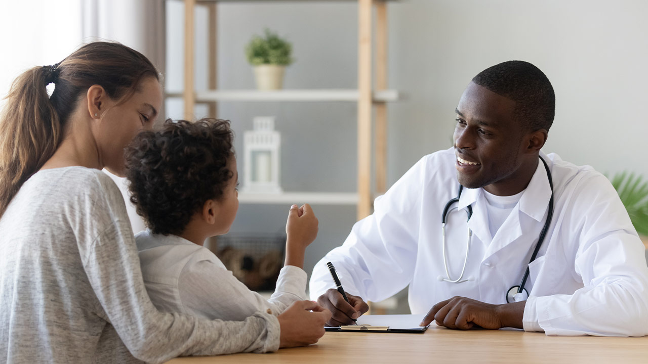 Doctor speaking with a mother and her child