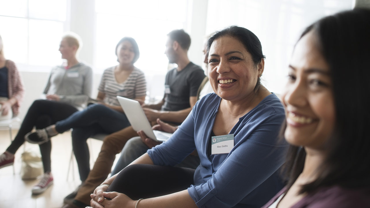 Group of smiling people in a room