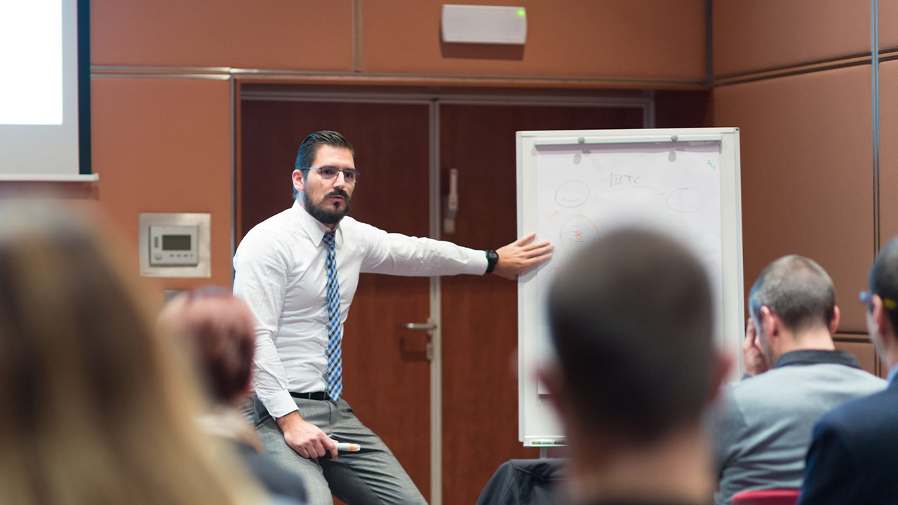 Man speaking to a group of people