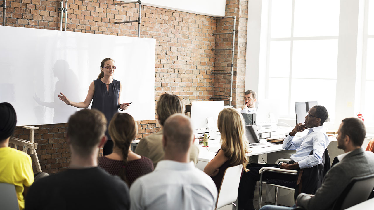 Women teaching a group of people